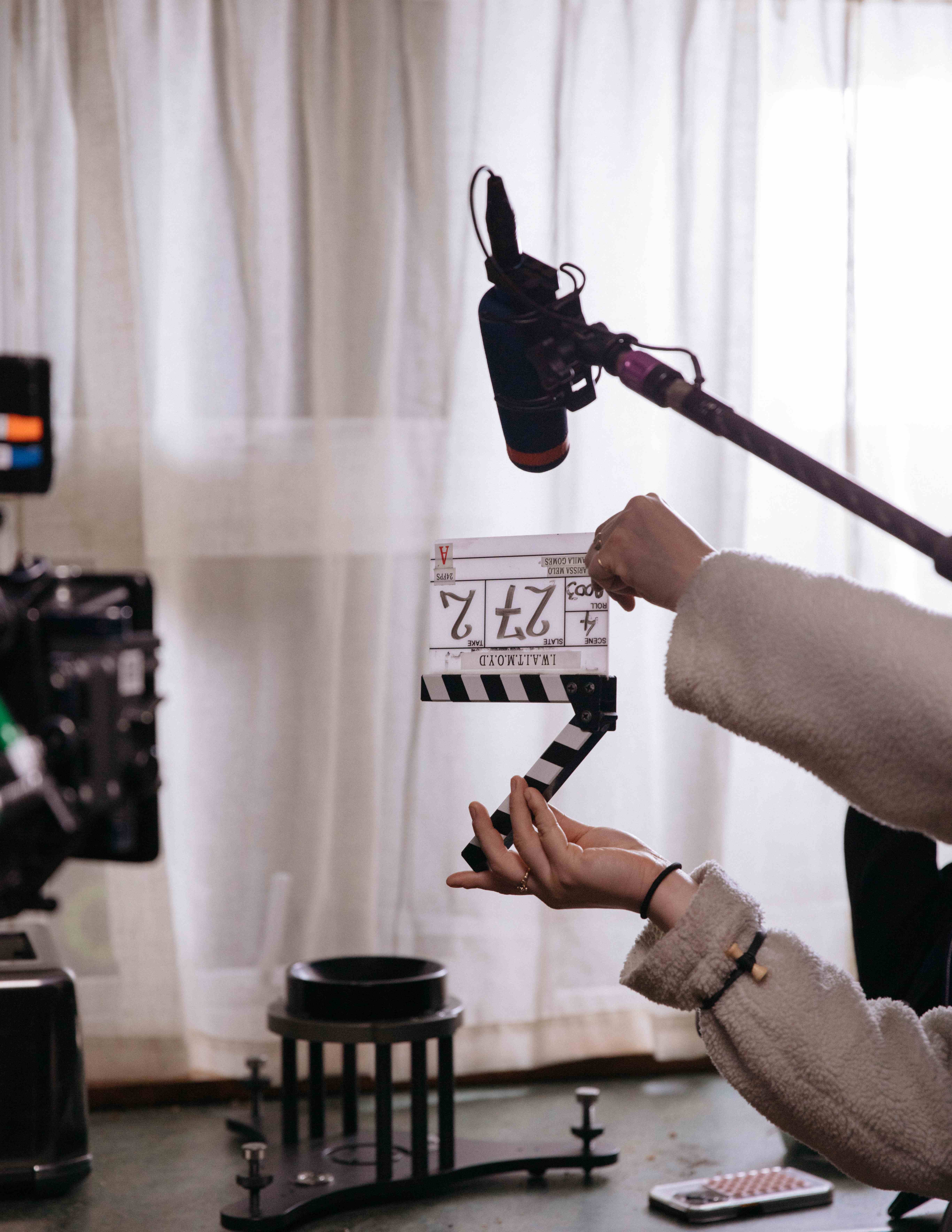 Filmmaker holding clapperboard during production