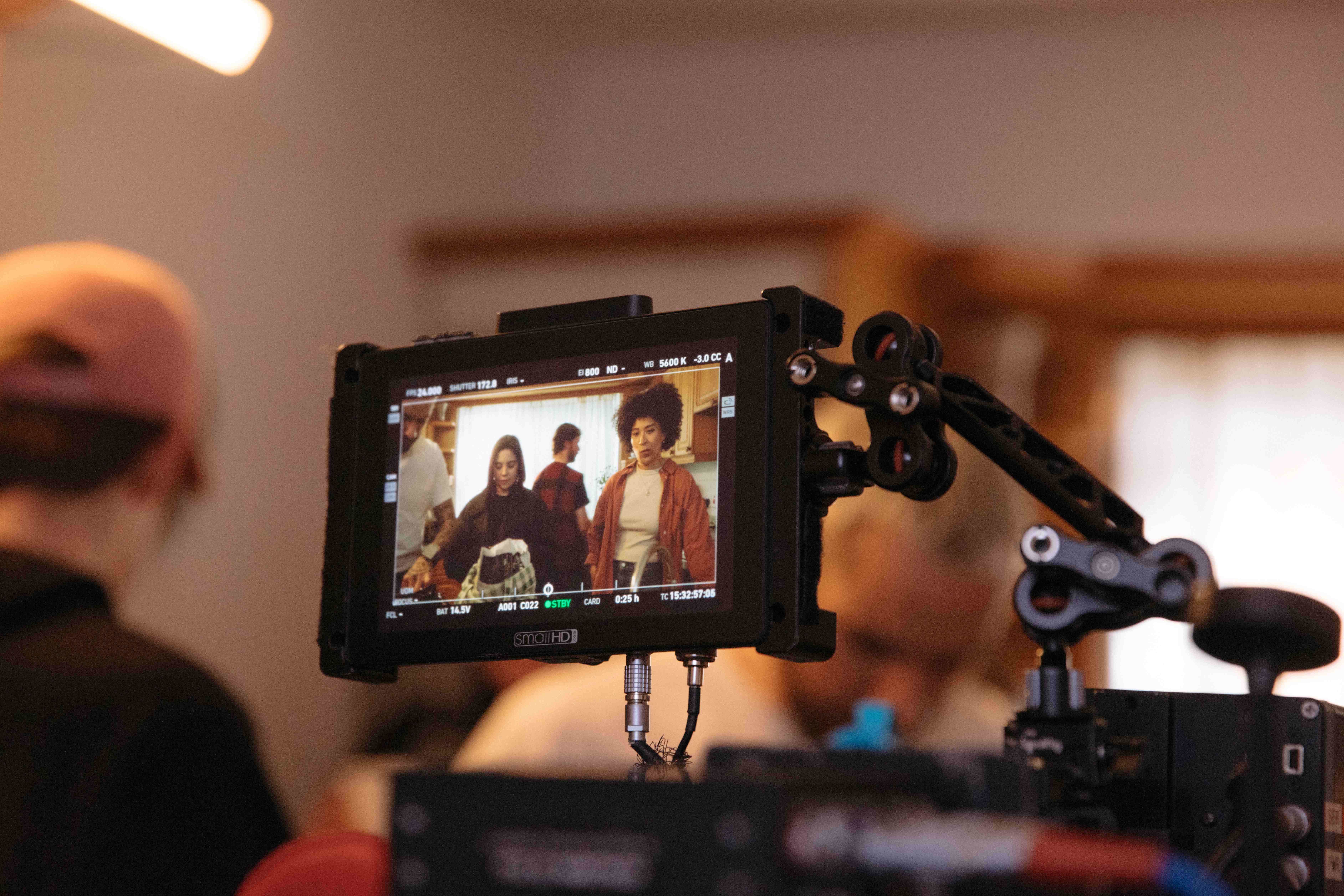 On-set production monitor showing filmed footage